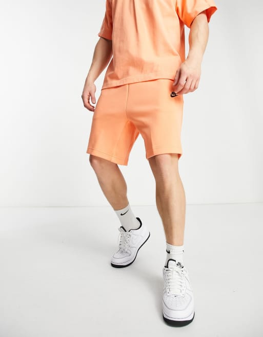 Nike tech shop fleece shorts orange