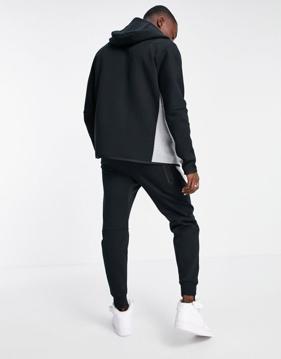 https://images.asos-media.com/products/nike-tech-fleece-sweatpants-in-black-and-gray-color-block-black/203237656-2?$n_550w$&wid=550&fit=constrain