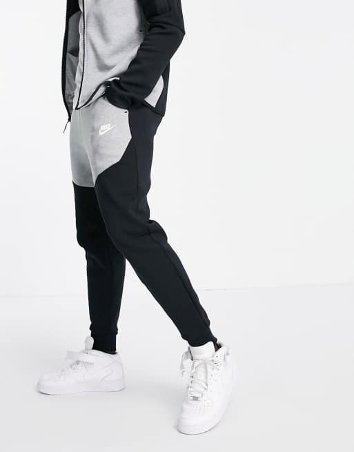 Forge huh Klasseværelse Nike Tech Fleece sweatpants in black and gray color block - BLACK | ASOS