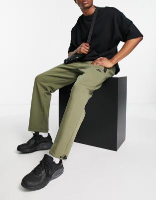 nike collection fleece loose fit cuffed sweatpants in green mgreen