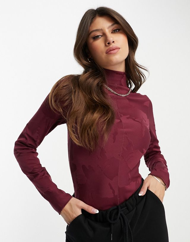 Nike tech high neck bodysuit in burgundy