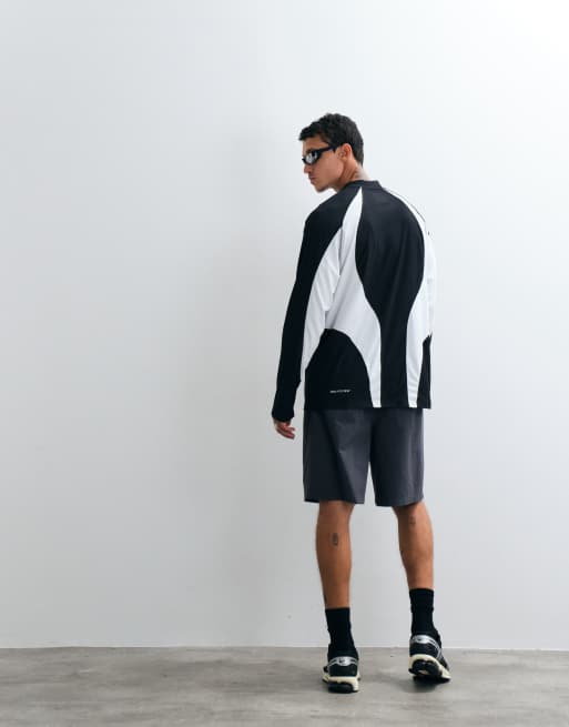 Nike Tech perforated central swoosh logo long sleeve top in black and white, 4 of 5