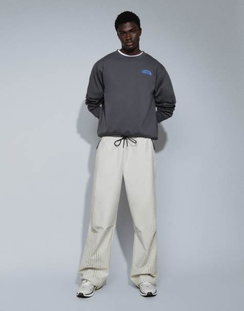 Nike Tech Shori joggers a gamba larga traforati beige chiaro - view 1