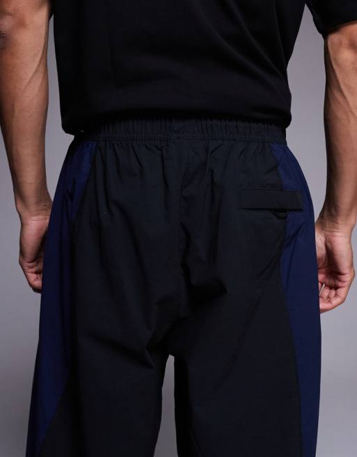 Nike - Tech - Sorte/blå vævede joggingbukser, 4 af 5