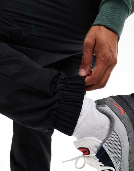 Nike Tech woven cargo pants in black | ASOS