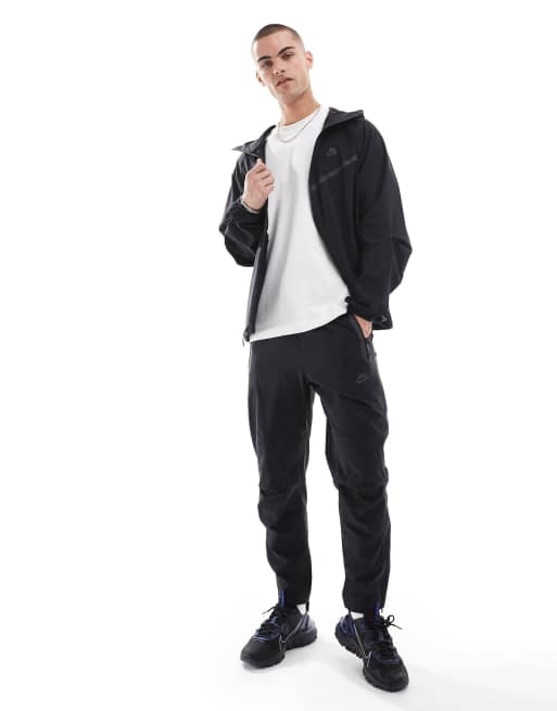 Nike Tech Woven full zip jacket in black | ASOS