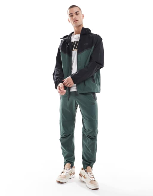 Nike Tech Woven full zip jacket in dark green and black | ASOS