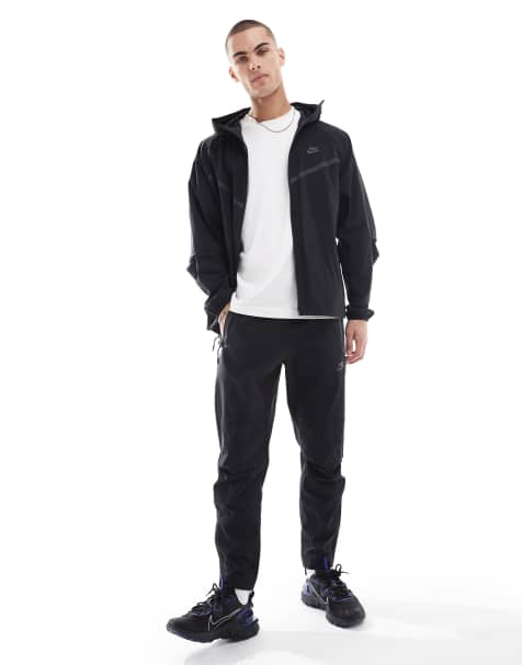 Nike Tech Woven open hem trousers in black - view 1