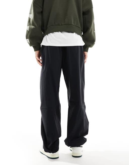 Nike Tech Woven oversized pants in black | ASOS