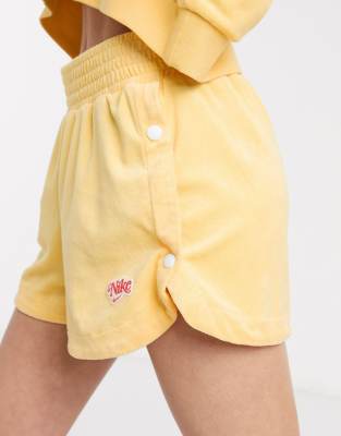 nike terry towelling shorts in yellow