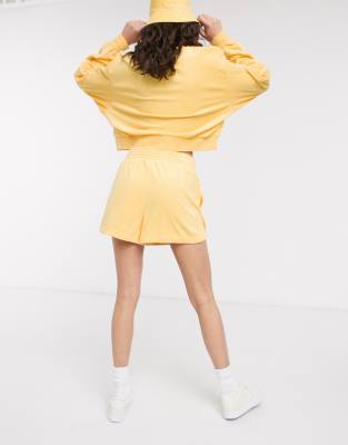 nike terry towelling shorts in yellow