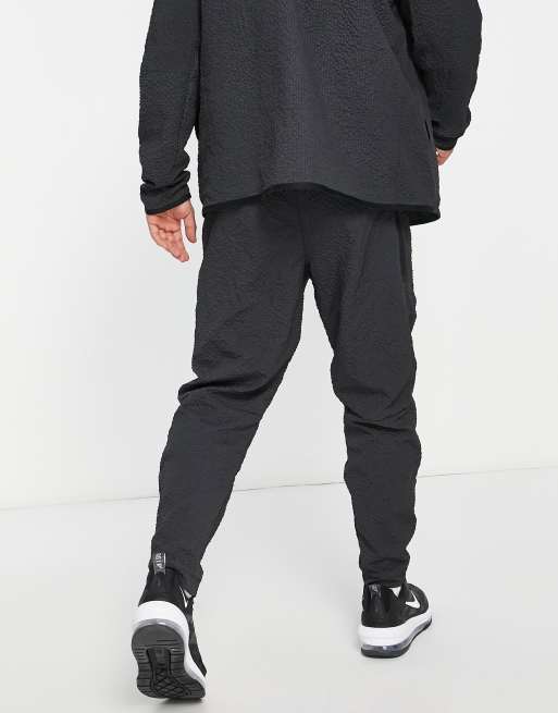 Nike tech store icon texture jogger