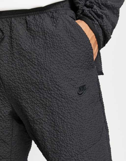 Nike textured tech fleece woven trousers in black