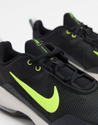 black nike trainers with green tick