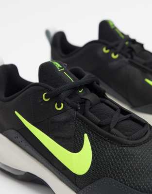 black and green nike trainers