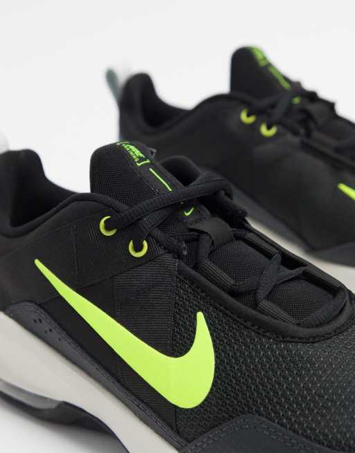 Neon green store and black trainers