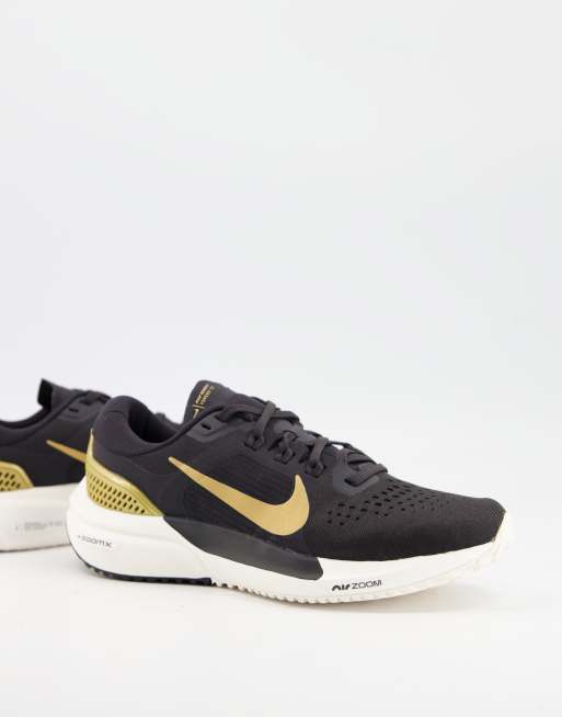 Nike black 2024 and gold trainers