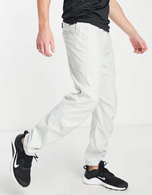 Nike Training Axis Pantalon de jogging en polaire Argent ASOS