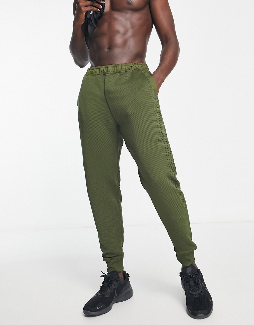 Nike Training Axis Therma-FIT ADV joggers in khaki-Green