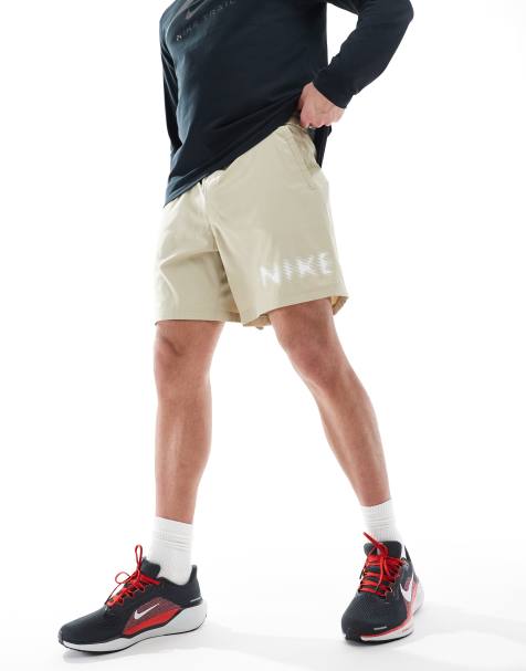 Nike Training blurred swoosh graphic 7 inch shorts in beige - view 1