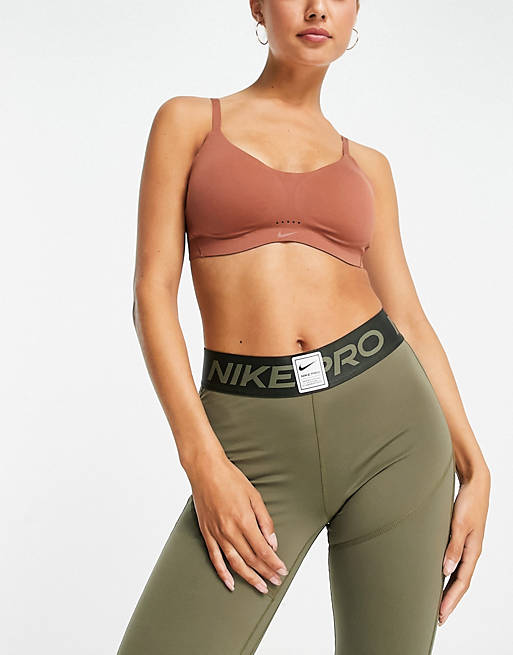 cat squeeze inference Nike Training Dri-FIT Alate Minimalist light support padded bra in brown |  ASOS
