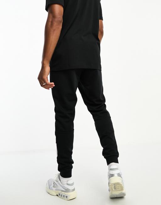 Nike taping skinny top fit joggers in black