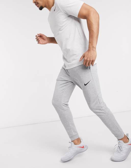 Nike Training Dri Fit Fleece Jogginghose mit engen Bundchen in Grau