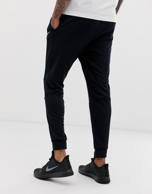 Nike Training dri fit fleece tapered sweatpants in black 860371