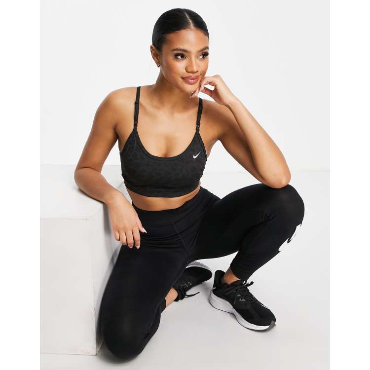 Nike Training Dri FIT Indy glitter leopard print light support sports bra in black ASOS