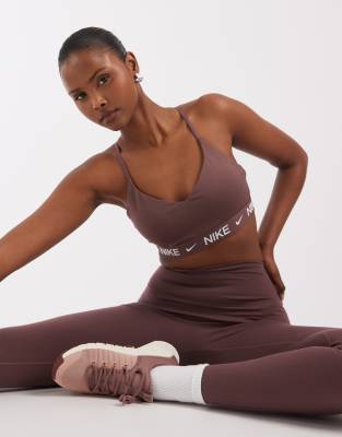 Nike Training Dri-FIT Indy light support sports bra in dark purple-Brown