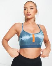 Nike Training Dri-FIT Indy Icon Clash all over print sports bra in lime