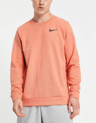 Nike Training Dri-FIT long sleeve crew sweat in dark pink