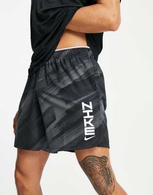 NIKE DRI-FIT SPORT CLASH GRAPHIC WOVEN SHORTS IN BLACK