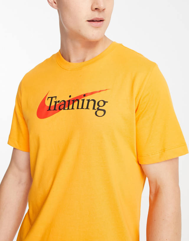 Nike Training Dri-FIT Swoosh logo t-shirt in mustard