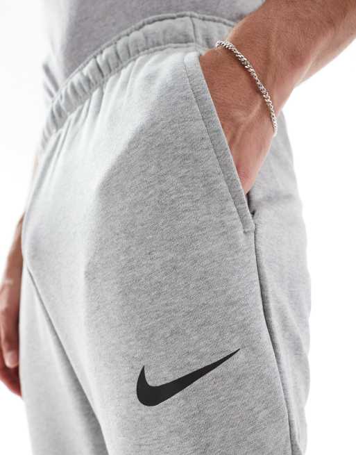 Nike Training Dri-FIT tapered joggers in light grey