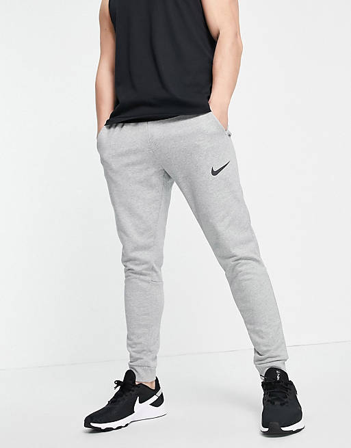 Nike Training Dri-FIT tapered joggers in light grey | ASOS