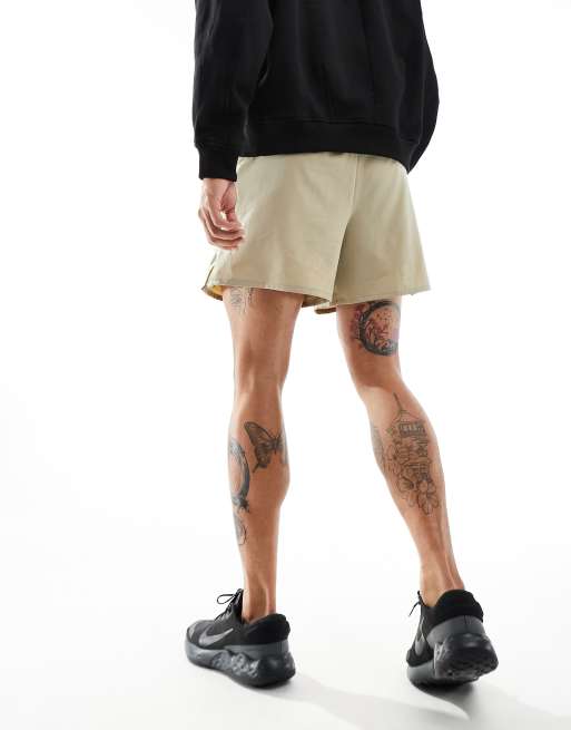 ASOS DESIGN slim nylon shorts with piping detail in khaki