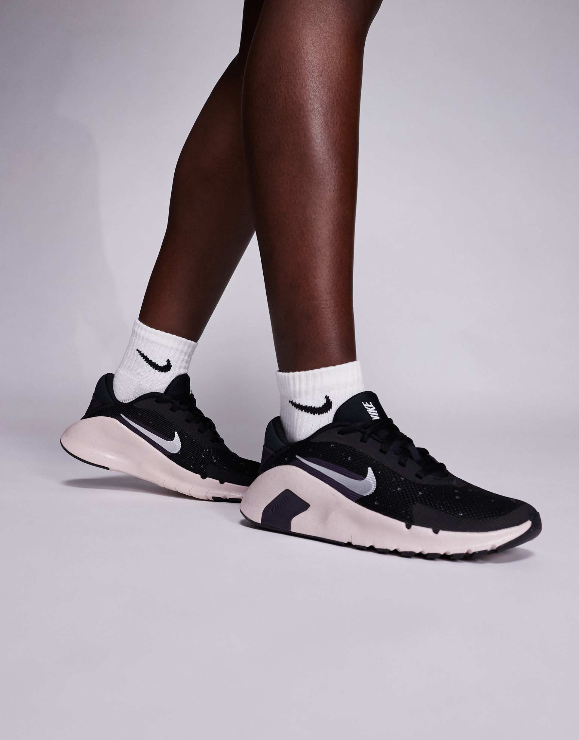 nike training flex sneakers in black and silver