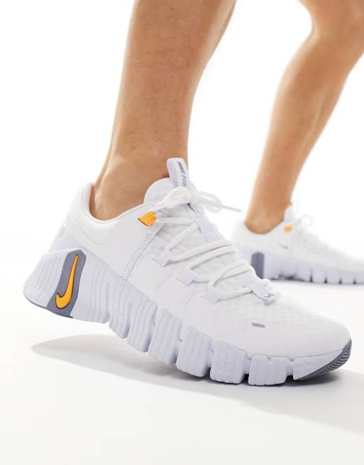 Nike training metcon sneakers in white and orange on sale