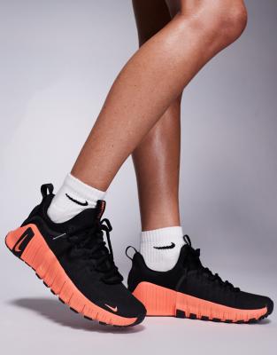 Free Metcon 6 sneakers in black and orange