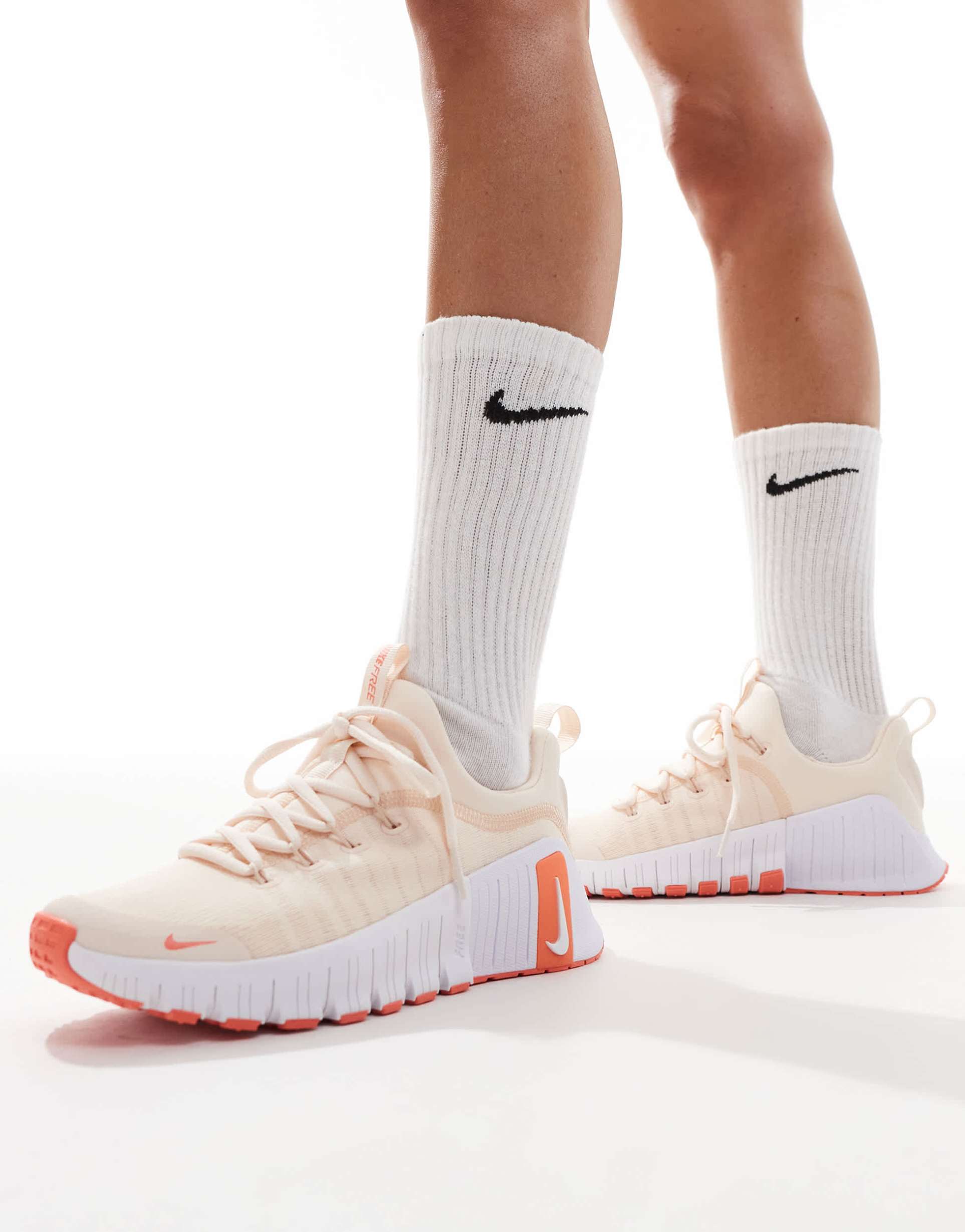 nike training free metcon 6 sneakers in light orange and white