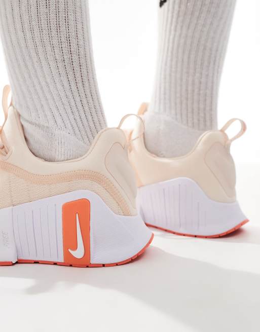 Nike Training Free Metcon 6 sneakers in light orange and white ASOS