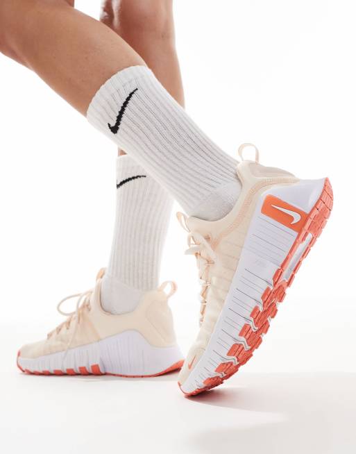 Nike Training Free Metcon 6 sneakers in light orange and white