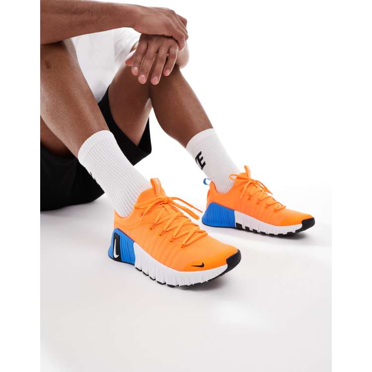 Nike Training Free Metcon trainers in orange ASOS