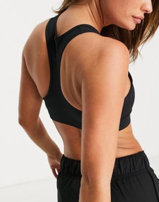 Nike Training Futura GX Dri-FIT Swoosh medium support sports bra in black |  ASOS
