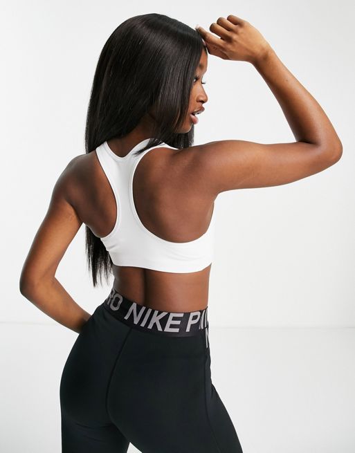 Nike Training Futura swoosh medium support sports bra in white