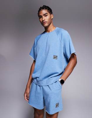 asos Nike Training Heritage fleece short sleeve top in blue