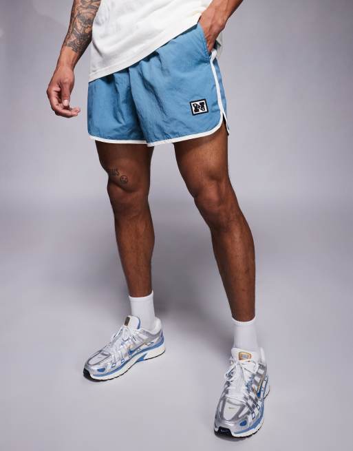 Nike Training Heritage taped 5 inch shorts in dark blue
