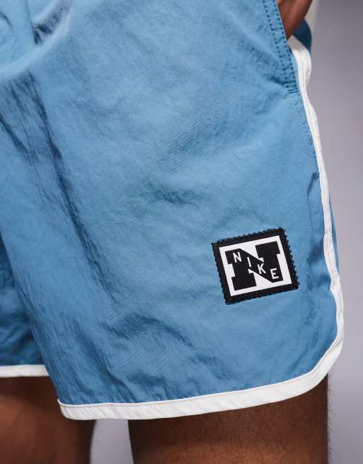 Nike Training Heritage taped 5 inch shorts in dark blue