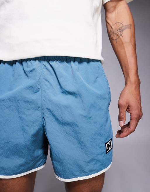 Nike Training Heritage taped 5 inch shorts in dark blue